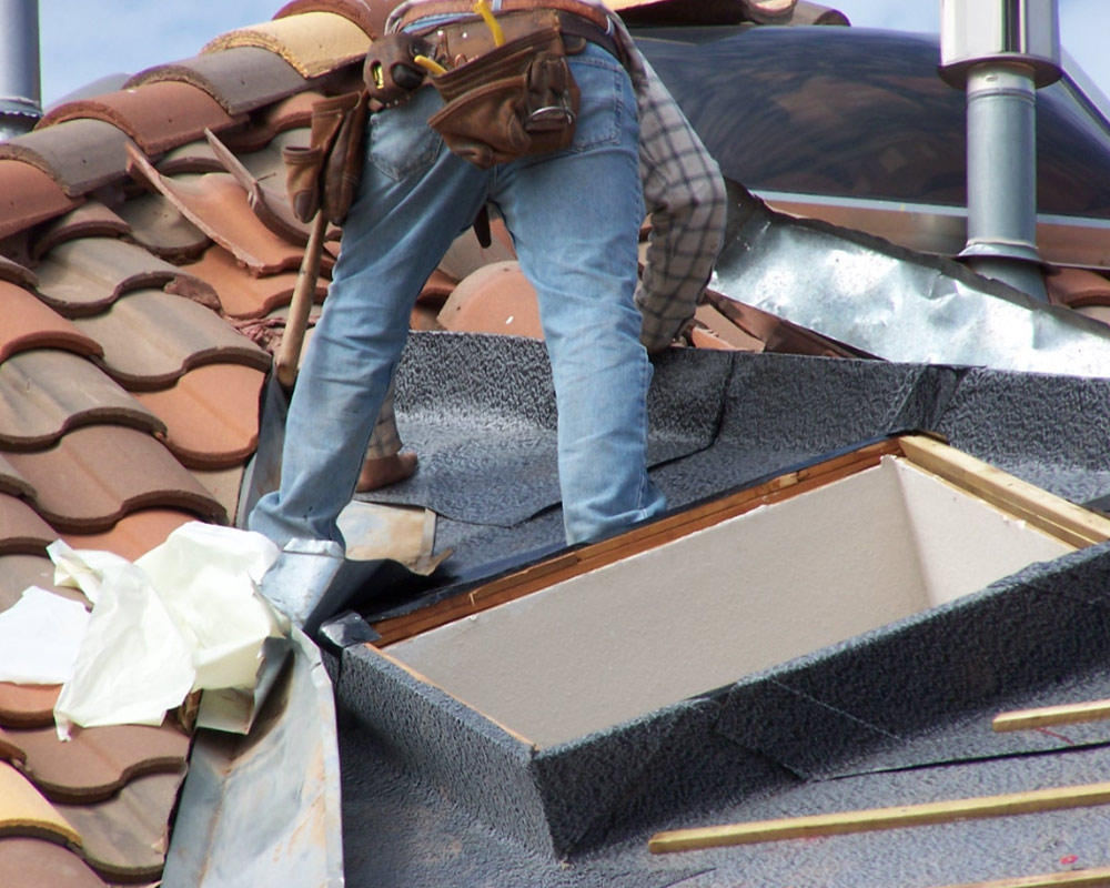 contractor repairing tiles roof to a house carrolton tx