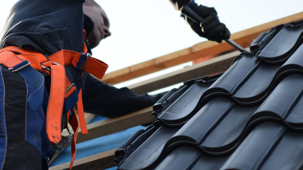 roofer repairing tiles roof carrolton tx